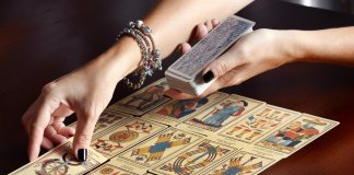 Placing tarot cards on table